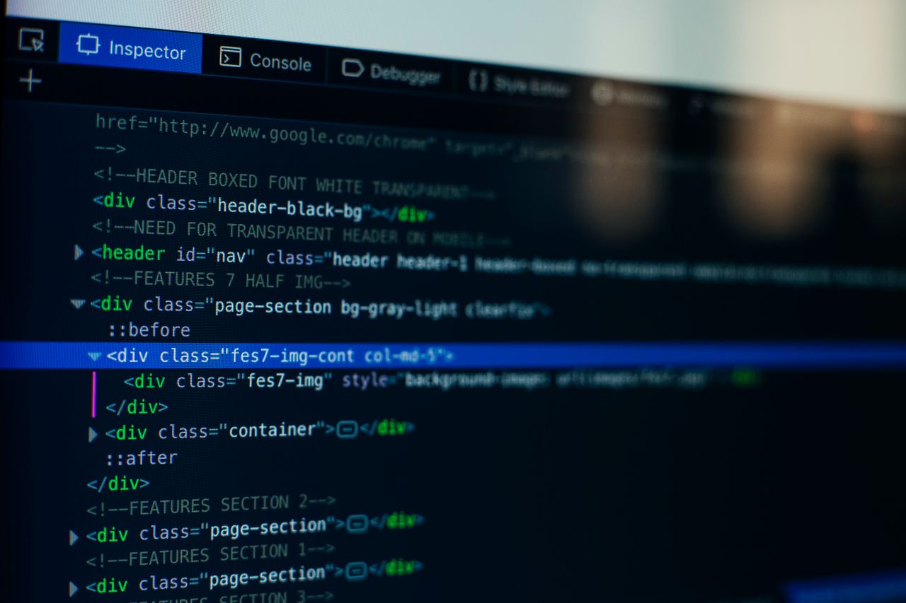 hero-img-01 Detailed view of HTML code on a computer screen, ideal for tech and software development themes.