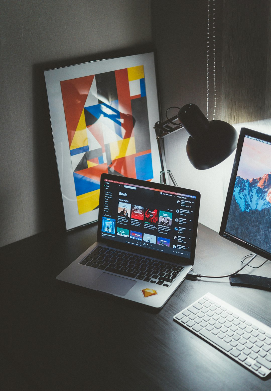 about-01 turned-on-macbook-on-table-beside-imac-g-yix8ynmny